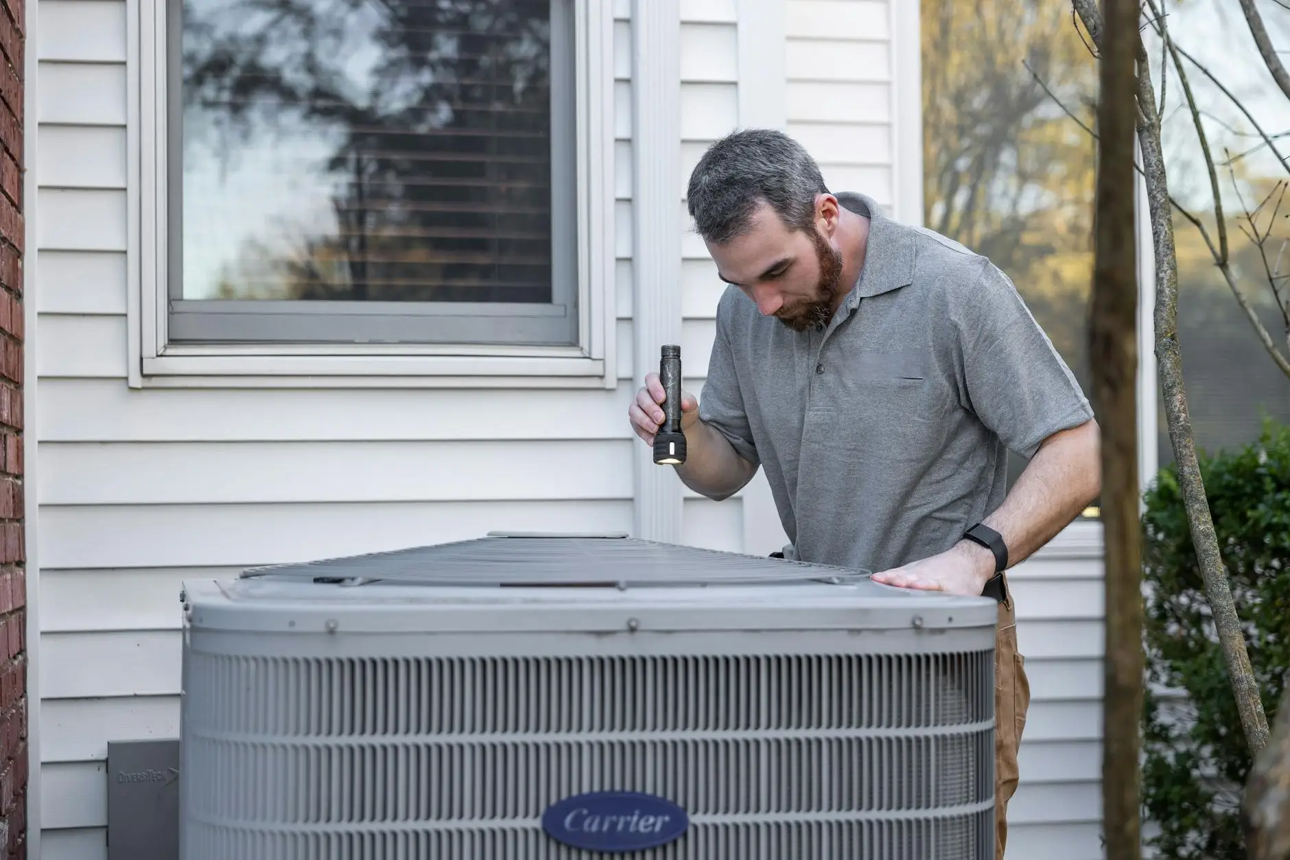 A high-capacity industrial dehumidifier and air movers set up in a Gretna basement to dry out hardwood flooring.